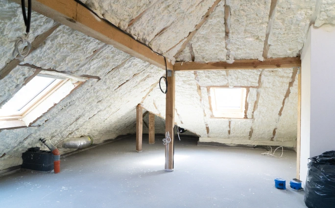 Spray foam being applied to new construction. Clean attic.